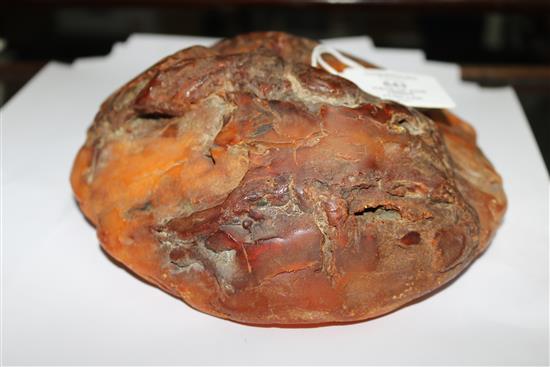 A large piece of raw amber, gross weight 1084 grams, approx. 7in by 7in by 3in.